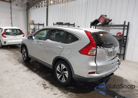 2016 Honda Cr-V Touring z USA, uszkodzony, nr VIN 5J6RM4H97GL073116